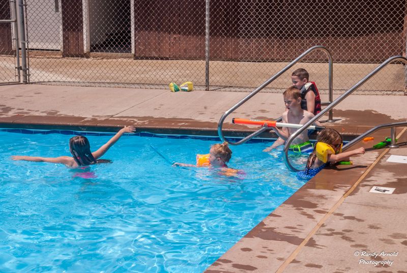 children having fun at the pool